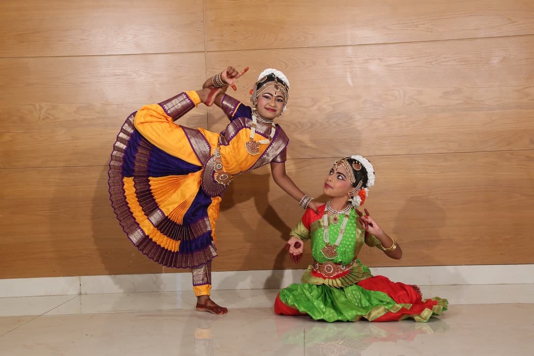 Bharatanatyam dancer in Aramandi posture during live performance